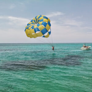 Parasailing, blue hole mineral spring, seven mile beach